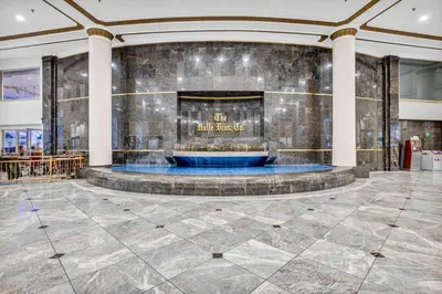 a lobby with a fountain in the center of a building at HUGE Luxury Flat in Playhouse Square | Downtown in Cleveland