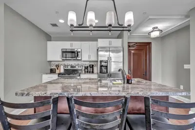 a kitchen with a large marble table and chairs at Location! Playhouse Sq ~ Fast Wi-Fi ~ Walkscore 96 in Cleveland