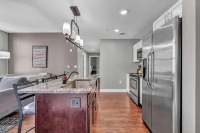 a kitchen with a large stainless steel refrigerator at Location! Playhouse Sq ~ Fast Wi-Fi ~ Walkscore 96 in Cleveland