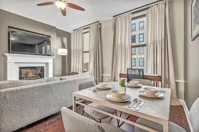 a living room with a couch and a table at Luxury Loft • Heart of Downtown• Parking/Gym in Cleveland