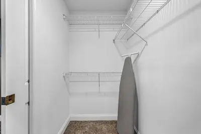 a room with a staircase in a white wall at Historic Loft in the Heart of Downtown • Gym in Cleveland