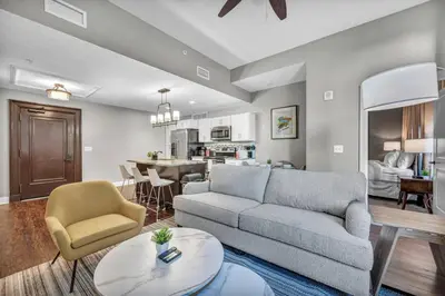 a living room with a couch and a table at Perfect Luxury Flat • Heart of Downtown • Gym in Cleveland