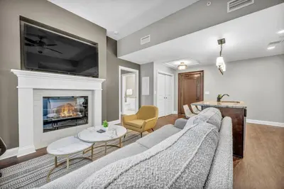 a living room with a couch and a fireplace at Perfect Luxury Flat • Heart of Downtown • Gym in Cleveland