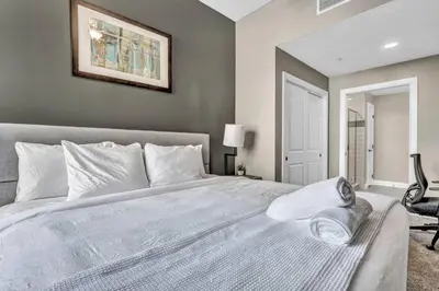 a bedroom with a large white bed in a room at Elegant Loft in the Heart of Downtown | Gym in Cleveland