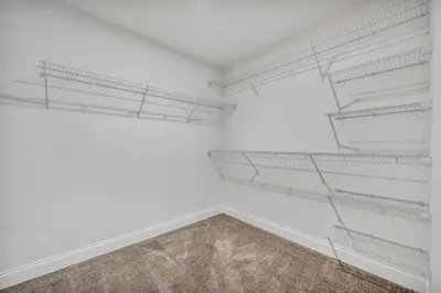 an empty room with white walls and white shelves at Elegant Downtown Loft w/ Parking & Gym in Cleveland