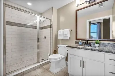a bathroom with a toilet and a shower at Luxury 2 Bedroom Loft in Heart of Downtown | Gym in Cleveland