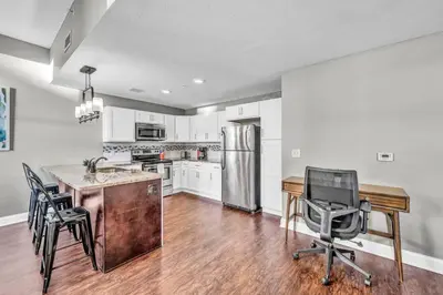 a kitchen with a desk and a computer in it at Stunning Downtown Condo with Parking & Gym in Cleveland