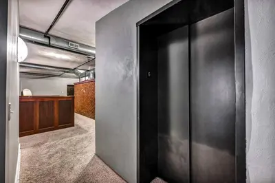 an open door in a room with a hallway at Unique 3BD Tremont Apartment in Cleveland