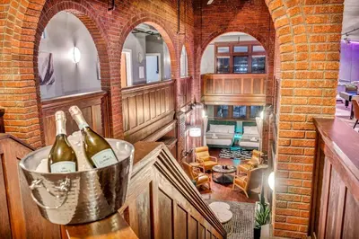 a kitchen with two bottles of wine in a bucket at Unique 3BD Tremont Apartment in Cleveland