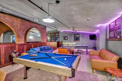 a living room with a pool table in it at Unique 3BD Tremont Apartment in Cleveland