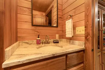 a bathroom with a sink and a mirror at Whiskey Ridge in Logan