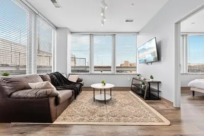 a living room with a couch and a table at Bright Downtown 1BR l Free Parking l Fast Wi-Fi in Cleveland