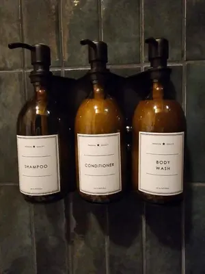 a group of three bottles of wine on a wall at Havenridge in Logan