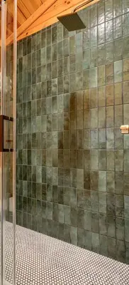 a tiled wall in a bathroom with a shower at Havenridge in Logan