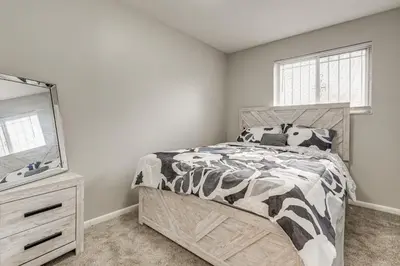 a bedroom with a bed and a mirror at 6 Mi to Downtown Columbus Quiet Home with Yard in Columbus