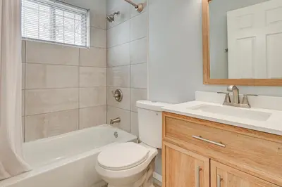 a white bathroom with a toilet and a sink at 6 Mi to Downtown Columbus Quiet Home with Yard in Columbus