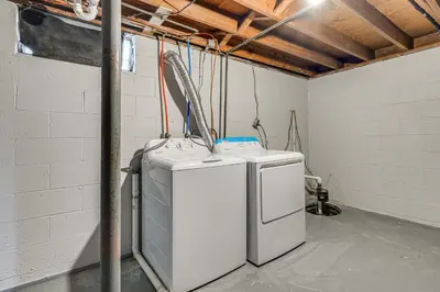 two refrigerators in a room in a building at 6 Mi to Downtown Columbus Quiet Home with Yard in Columbus