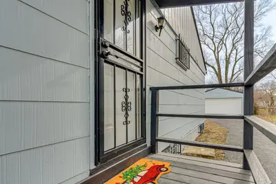 a porch with an open door to a house at 6 Mi to Downtown Columbus Quiet Home with Yard in Columbus