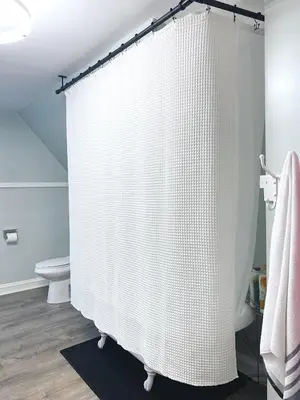 a bathroom with a shower curtain and a toilet at 3rd Floor Retreat Near Cleveland Clinic & Downtown in Shaker Heights