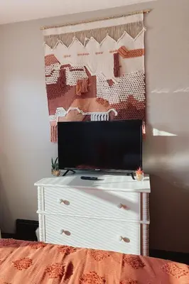 a white dresser with a television on top of it at 3rd Floor Retreat Near Cleveland Clinic & Downtown in Shaker Heights