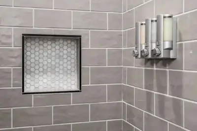 a tiled bathroom with a shower with a mirror at 230 Entire Complex 2 homes side by side in Columbus