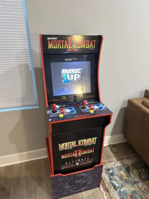 a video game machine in a corner of a room at 230 Entire Complex 2 homes side by side in Columbus