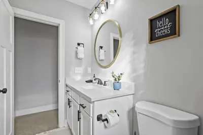 a white bathroom with a sink and a mirror at 293 Perfect for companies in Columbus