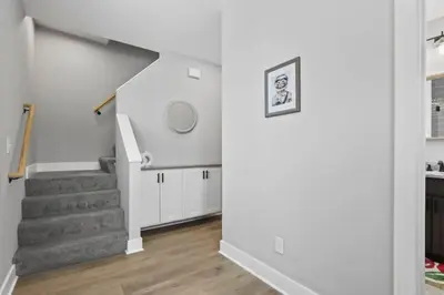 a staircase in a living room with white walls at 293 Perfect for companies in Columbus