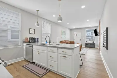 a kitchen with white cabinets and a sink at 293 Perfect for companies in Columbus