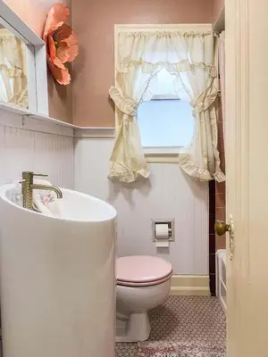a bathroom with a toilet and a tub and a window at Peaches and Cream Coffee and Confetti Villa in Dayton
