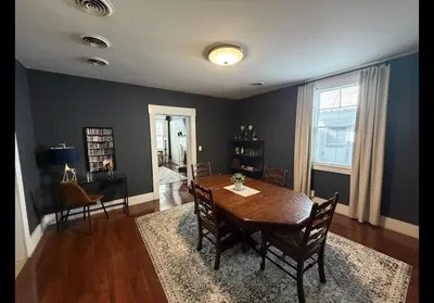 a dining room with a wooden table and chairs at The Study in Chillicothe
