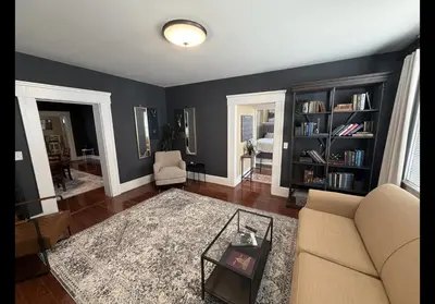 a living room with a couch and a table at The Study in Chillicothe