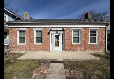 a red brick house with a white door at The Study in Chillicothe