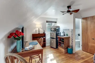 a kitchen with a table and a ceiling fan at 3 Mi to UD and Kettering Health! Suburban Stay in Dayton