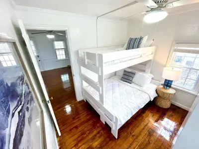 a bedroom with two bunk beds in a room at Coastal Cape Cod w/ King Bed, Game Room, & Bikes! in Vermilion
