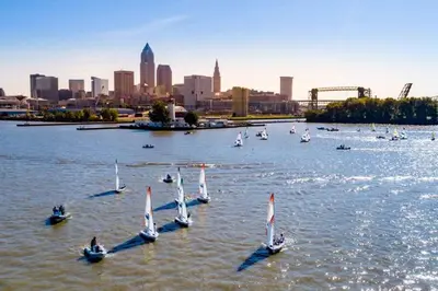 a group of sailboats in the water with a city at Vintage, Mid-Century Suite above Antique Store in Wakeman