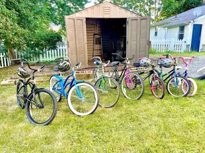 a group of bikes parked in front of a house at ENTIRE UNIT- Charming Century Home in Harbour Town in Vermilion