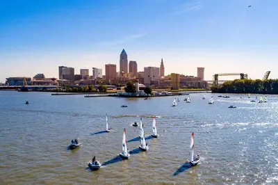 a group of sailboats in the water with a city at ENTIRE UNIT- Charming Century Home in Harbour Town in Vermilion