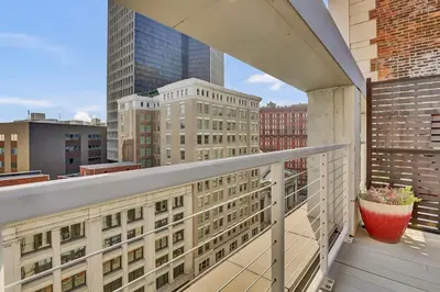 a balcony with a view of a city at LoFi Loft Life DT Cleveland Gym Terrace in Cleveland