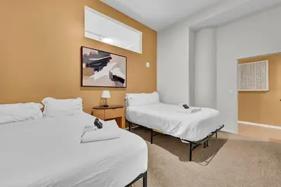 a room with two beds and a window at Black & Tan Bold Style Smooth Finish Served Daily in Cleveland