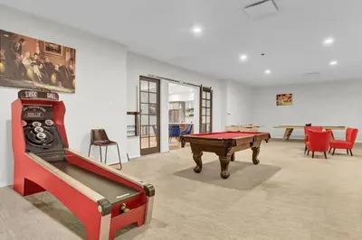 a room with a pool table and some chairs at Billiards & Balcony 2Bx2B Rooftop It's Lit in Cleveland