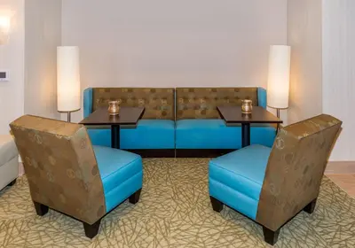 a waiting room with two tables and two chairs at Hampton Inn & Suites New Albany Columbus in New Albany