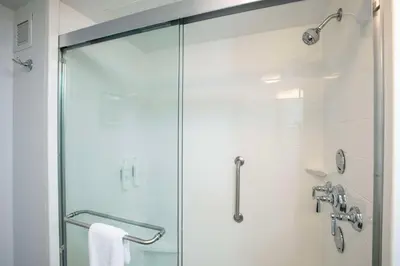 a shower with a glass door in a bathroom at Hampton Inn & Suites - Cincinnati/Kenwood, OH in Cincinnati