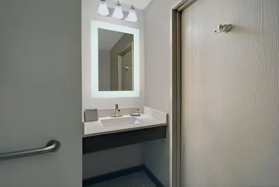 a bathroom with a sink and a mirror at Holiday Inn Express Adrian by IHG in Adrian