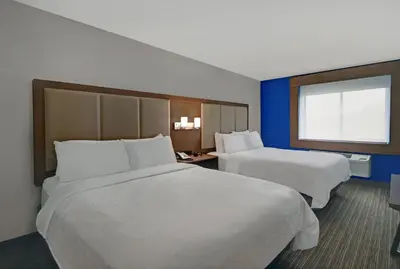 a hotel room with two beds and a window at Holiday Inn Express Adrian by IHG in Adrian