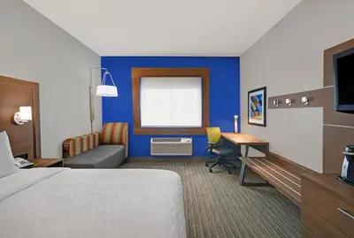 a hotel room with a bed and a desk at Holiday Inn Express Adrian by IHG in Adrian