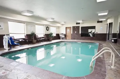 a large swimming pool in a hotel room at Holiday Inn Express Adrian by IHG in Adrian