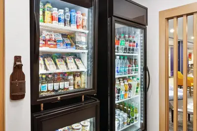 an open refrigerator filled with lots of drinks at Holiday Inn Express Cleveland Airport - Brook Park by IHG in Brook Park