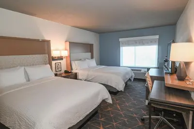 a hotel room with two beds and a window at Holiday Inn Cleveland-Mayfield by IHG in Mayfield