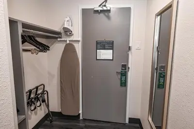 a hospital hallway with a door in a room at Holiday Inn Cleveland-Mayfield by IHG in Mayfield